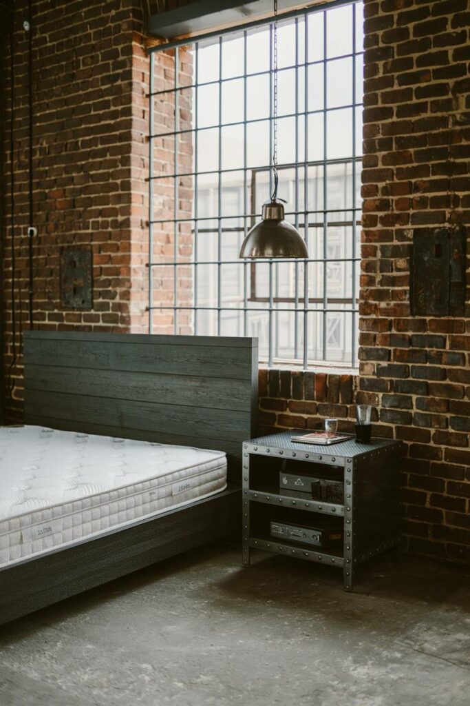 6. Metal Pendant Lamp with Concrete Floor Industrial Bedroom